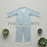 Blue crane print lace trim pyjama set by Ivory Nights - flat lay