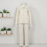 Korean Gold Heart PJ Set - mannequin front view showing ivory top with gold heart print and matching trousers