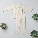 Ivory ribbon print PJ set laid flat - top and trousers