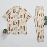 Brushstroke Print PJ Set - flat lay showing cream abstract print button-down shirt and matching trousers