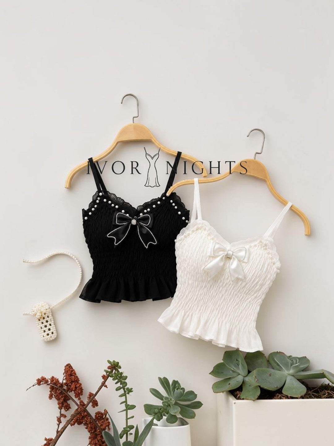 Ivory Nights pearl and bow embellished cami top in black and white